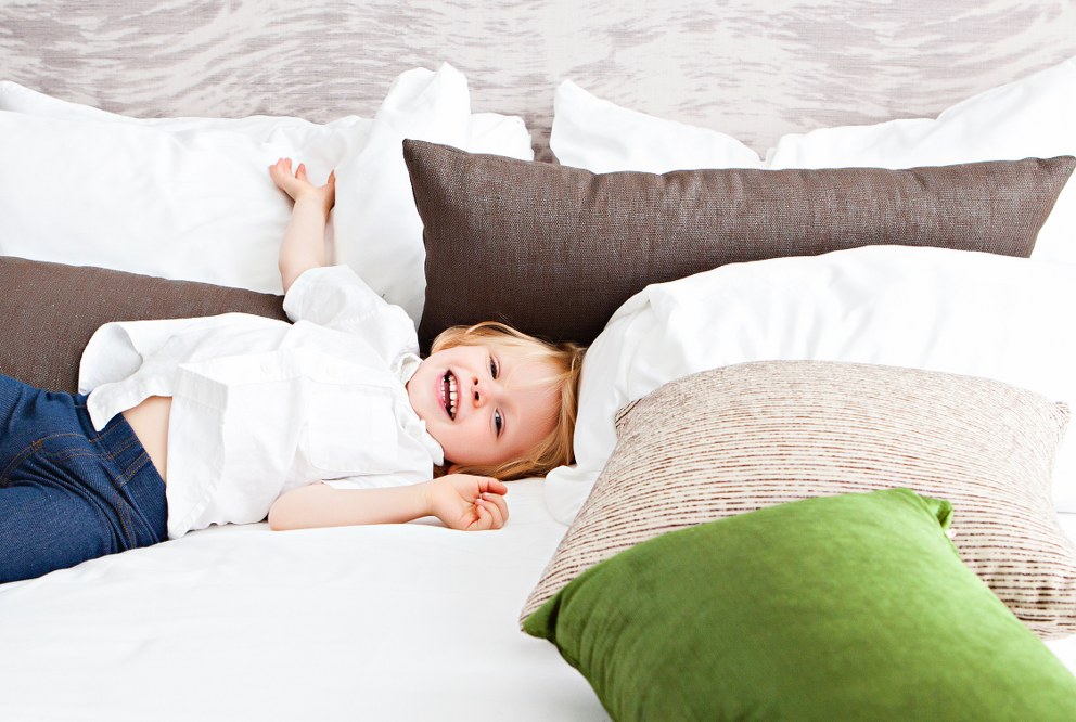 Good mattress for kids - child sleeping on parents' bed